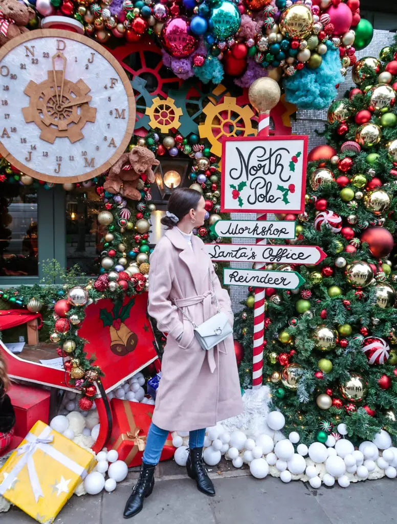 Amy looking at decorations of The Ivy Chelsea Garden